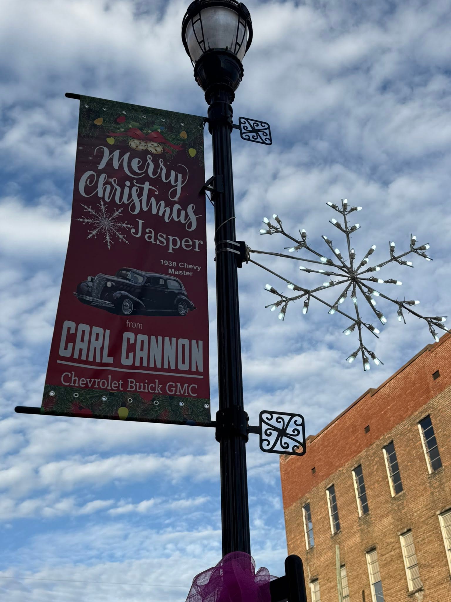 Merry Christmas Jasper from Carl Cannon flag on a street light