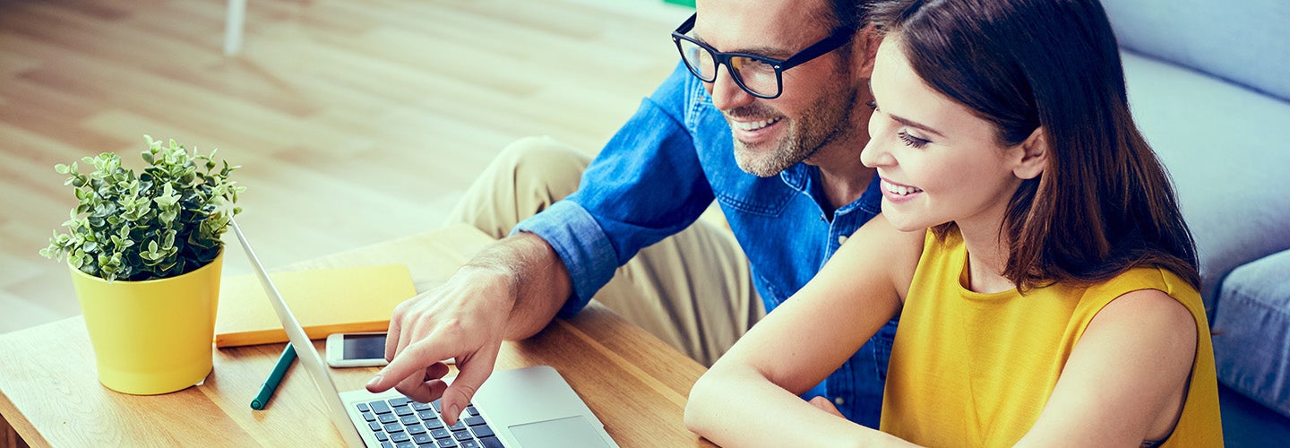 Couple Using Laptop